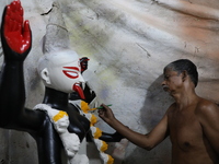 An artist paints an idol of the Hindu goddess Kali inside a workshop in Kolkata, India, on October 21, 2024. Diwali comes from the Sanskrit...