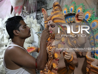 An artist paints an idol of the Hindu goddess Kali inside a workshop in Kolkata, India, on October 21, 2024. Diwali comes from the Sanskrit...