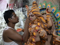 An artist paints an idol of the Hindu goddess Kali inside a workshop in Kolkata, India, on October 21, 2024. Diwali comes from the Sanskrit...