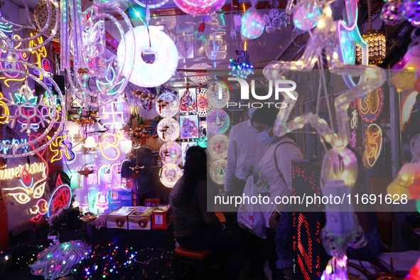 People buy decorative lights ahead of the Diwali festival in Kolkata, India, on October 21, 2024. Diwali comes from the Sanskrit word deepav...