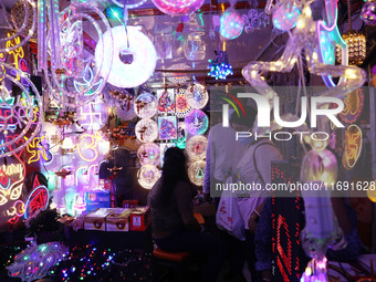 People buy decorative lights ahead of the Diwali festival in Kolkata, India, on October 21, 2024. Diwali comes from the Sanskrit word deepav...