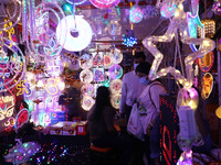 People buy decorative lights ahead of the Diwali festival in Kolkata, India, on October 21, 2024. Diwali comes from the Sanskrit word deepav...