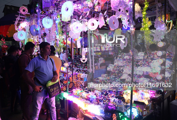 People buy decorative lights ahead of the Diwali festival in Kolkata, India, on October 21, 2024. Diwali comes from the Sanskrit word deepav...