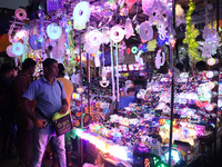 People buy decorative lights ahead of the Diwali festival in Kolkata, India, on October 21, 2024. Diwali comes from the Sanskrit word deepav...