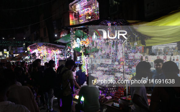 People buy decorative lights ahead of the Diwali festival in Kolkata, India, on October 21, 2024. Diwali comes from the Sanskrit word deepav...