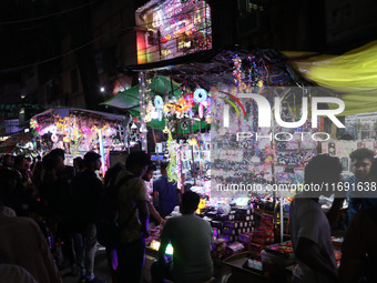 People buy decorative lights ahead of the Diwali festival in Kolkata, India, on October 21, 2024. Diwali comes from the Sanskrit word deepav...