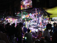 People buy decorative lights ahead of the Diwali festival in Kolkata, India, on October 21, 2024. Diwali comes from the Sanskrit word deepav...