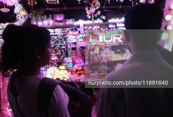 People buy decorative lights ahead of the Diwali festival in Kolkata, India, on October 21, 2024. Diwali comes from the Sanskrit word deepav...