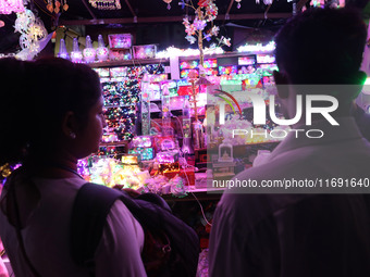 People buy decorative lights ahead of the Diwali festival in Kolkata, India, on October 21, 2024. Diwali comes from the Sanskrit word deepav...