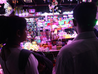 People buy decorative lights ahead of the Diwali festival in Kolkata, India, on October 21, 2024. Diwali comes from the Sanskrit word deepav...