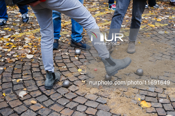 CLAP Montmartre members play petanque on the road after being evicted from the ground on Rue Junot, where they have played boules for fifty...