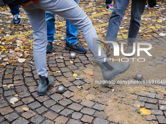 CLAP Montmartre members play petanque on the road after being evicted from the ground on Rue Junot, where they have played boules for fifty...