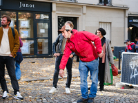 Members of the Lepic Abbesses Petanque Club (CLAP Montmartre) protest against the closure of their pitch by playing on the cobblestones of t...