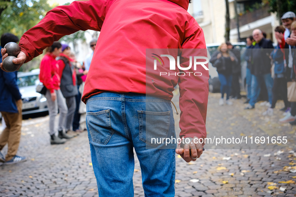 A CLAP Montmartre activist plays petanque on the road in front of the bowling green from which the association is expelled by the city of Pa...