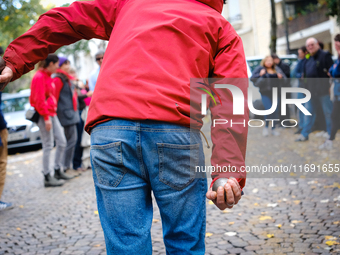 A CLAP Montmartre activist plays petanque on the road in front of the bowling green from which the association is expelled by the city of Pa...