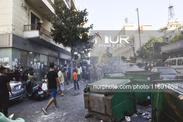 Displaced people who flee Israeli bombardment in Beirut's southern suburbs clash with Lebanese security forces attempting to evict them from...