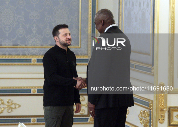 US Secretary of Defense Lloyd Austin and President of Ukraine Volodymyr Zelenskyy shake hands during their meeting in Kyiv, Ukraine, on Octo...