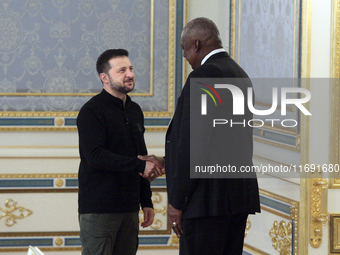 US Secretary of Defense Lloyd Austin and President of Ukraine Volodymyr Zelenskyy shake hands during their meeting in Kyiv, Ukraine, on Octo...