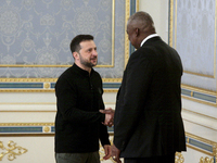 US Secretary of Defense Lloyd Austin and President of Ukraine Volodymyr Zelenskyy shake hands during their meeting in Kyiv, Ukraine, on Octo...