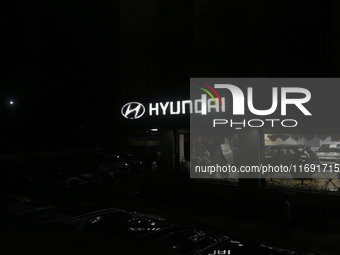 The signage of Hyundai Motor India Ltd. is seen in front of an authorized Hyundai showroom in Mumbai, India, on October 21, 2024. The listin...