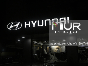 The signage of Hyundai Motor India Ltd. is seen in front of an authorized Hyundai showroom in Mumbai, India, on October 21, 2024. The listin...