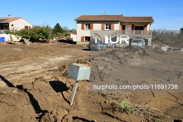 Several volunteers and residents participate in the restoration of the village of Limony in Ardeche, France, on October 21, 2024, after the...