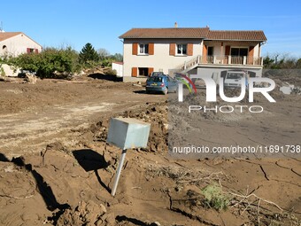 Several volunteers and residents participate in the restoration of the village of Limony in Ardeche, France, on October 21, 2024, after the...