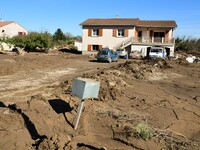 Several volunteers and residents participate in the restoration of the village of Limony in Ardeche, France, on October 21, 2024, after the...