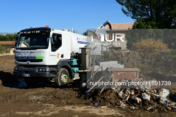 Several volunteers and residents participate in the restoration of the village of Limony in Ardeche, France, on October 21, 2024, after the...