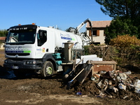 Several volunteers and residents participate in the restoration of the village of Limony in Ardeche, France, on October 21, 2024, after the...