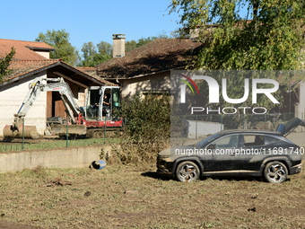 Several volunteers and residents participate in the restoration of the village of Limony in Ardeche, France, on October 21, 2024, after the...