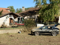 Several volunteers and residents participate in the restoration of the village of Limony in Ardeche, France, on October 21, 2024, after the...