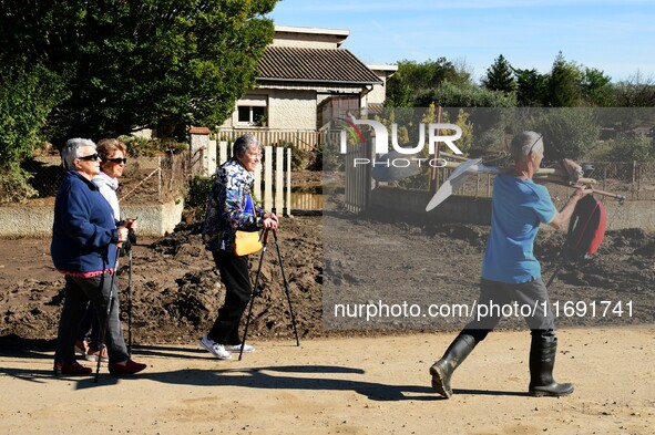 Several volunteers and residents participate in the restoration of the village of Limony in Ardeche, France, on October 21, 2024, after the...