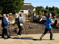 Several volunteers and residents participate in the restoration of the village of Limony in Ardeche, France, on October 21, 2024, after the...