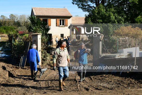 Several volunteers and residents participate in the restoration of the village of Limony in Ardeche, France, on October 21, 2024, after the...