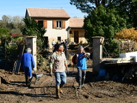 Several volunteers and residents participate in the restoration of the village of Limony in Ardeche, France, on October 21, 2024, after the...