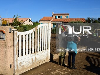 Several volunteers and residents participate in the restoration of the village of Limony in Ardeche, France, on October 21, 2024, after the...