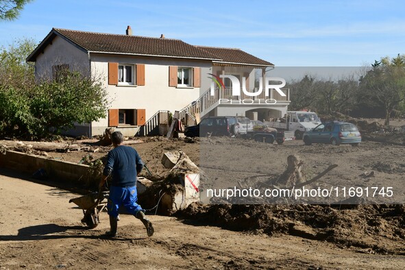 Several volunteers and residents participate in the restoration of the village of Limony in Ardeche, France, on October 21, 2024, after the...