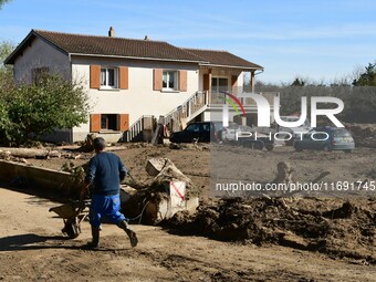 Several volunteers and residents participate in the restoration of the village of Limony in Ardeche, France, on October 21, 2024, after the...