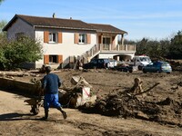 Several volunteers and residents participate in the restoration of the village of Limony in Ardeche, France, on October 21, 2024, after the...