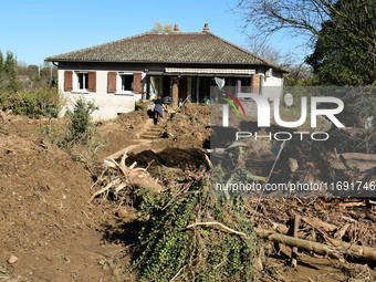 Several volunteers and residents participate in the restoration of the village of Limony in Ardeche, France, on October 21, 2024, after the...