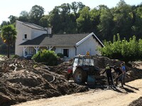 Several volunteers and residents participate in the restoration of the village of Limony in Ardeche, France, on October 21, 2024, after the...