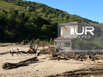 Several volunteers and residents participate in the restoration of the village of Limony in Ardeche, France, on October 21, 2024, after the...