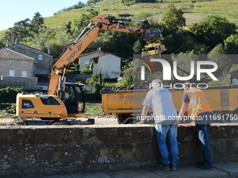 Several volunteers and residents participate in the restoration of the village of Limony in Ardeche, France, on October 21, 2024, after the...