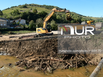 Several volunteers and residents participate in the restoration of the village of Limony in Ardeche, France, on October 21, 2024, after the...