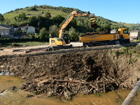 Several volunteers and residents participate in the restoration of the village of Limony in Ardeche, France, on October 21, 2024, after the...