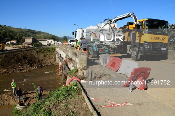 Several volunteers and residents participate in the restoration of the village of Limony in Ardeche, France, on October 21, 2024, after the...