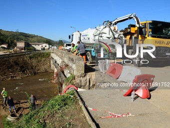 Several volunteers and residents participate in the restoration of the village of Limony in Ardeche, France, on October 21, 2024, after the...