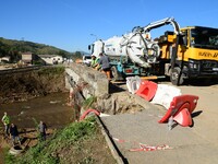 Several volunteers and residents participate in the restoration of the village of Limony in Ardeche, France, on October 21, 2024, after the...