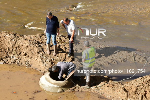 Several volunteers and residents participate in the restoration of the village of Limony in Ardeche, France, on October 21, 2024, after the...